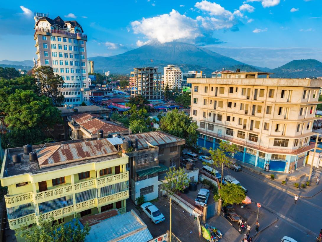 Students joining the Backpack University look over the skyline of Arusha in Tanzania